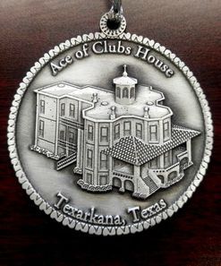Silver medallion of the Ace of Clubs House in Texarkana, Texas.