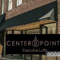 Centerpoint Executive Lofts building exterior with black awning and signage over storefront windows.