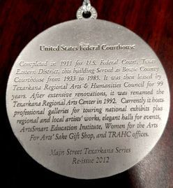 Medal with text about the United States Federal Courthouse in Texarkana, Texas, including its history and current uses.