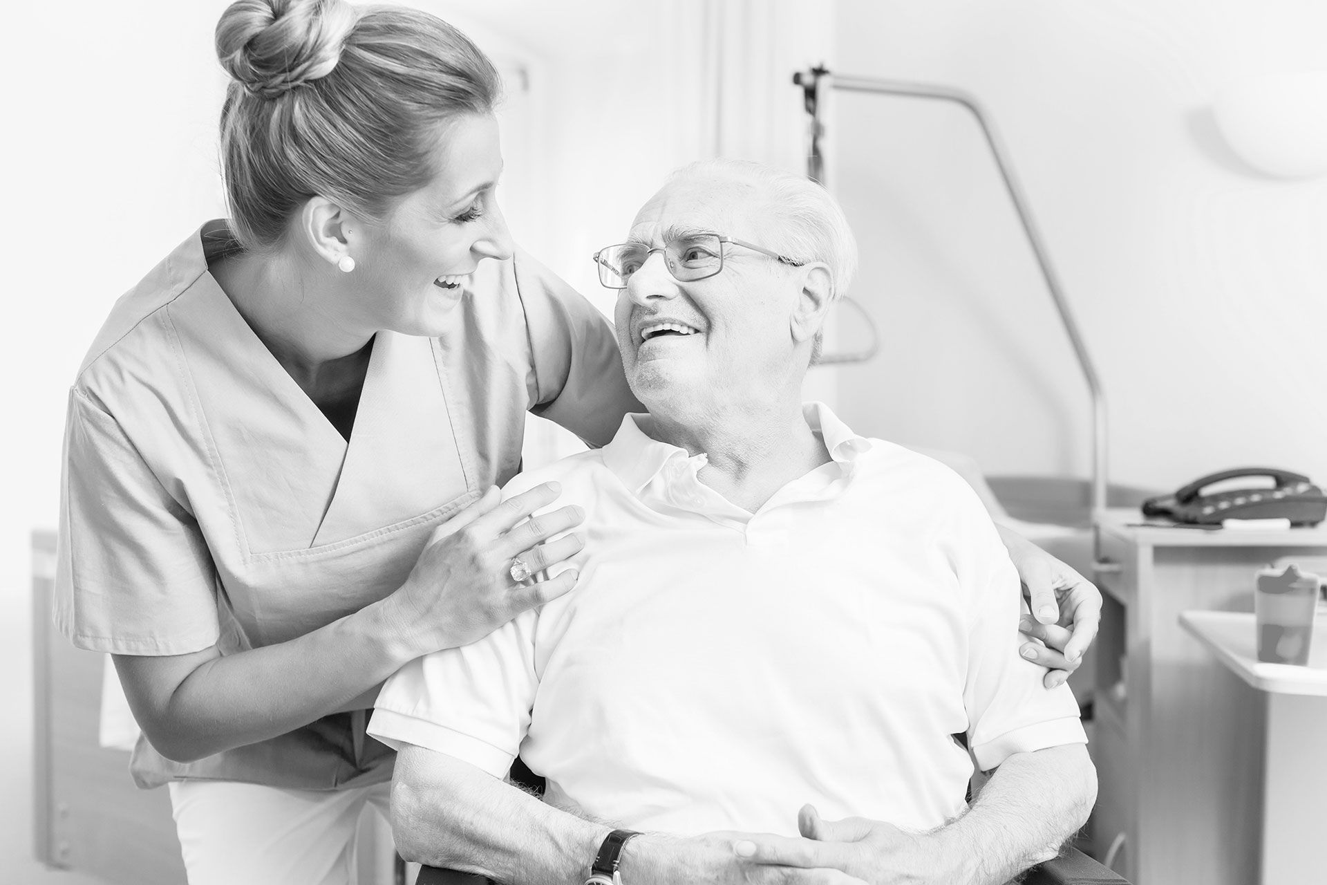 Senior man and old age nurse in nursing home
