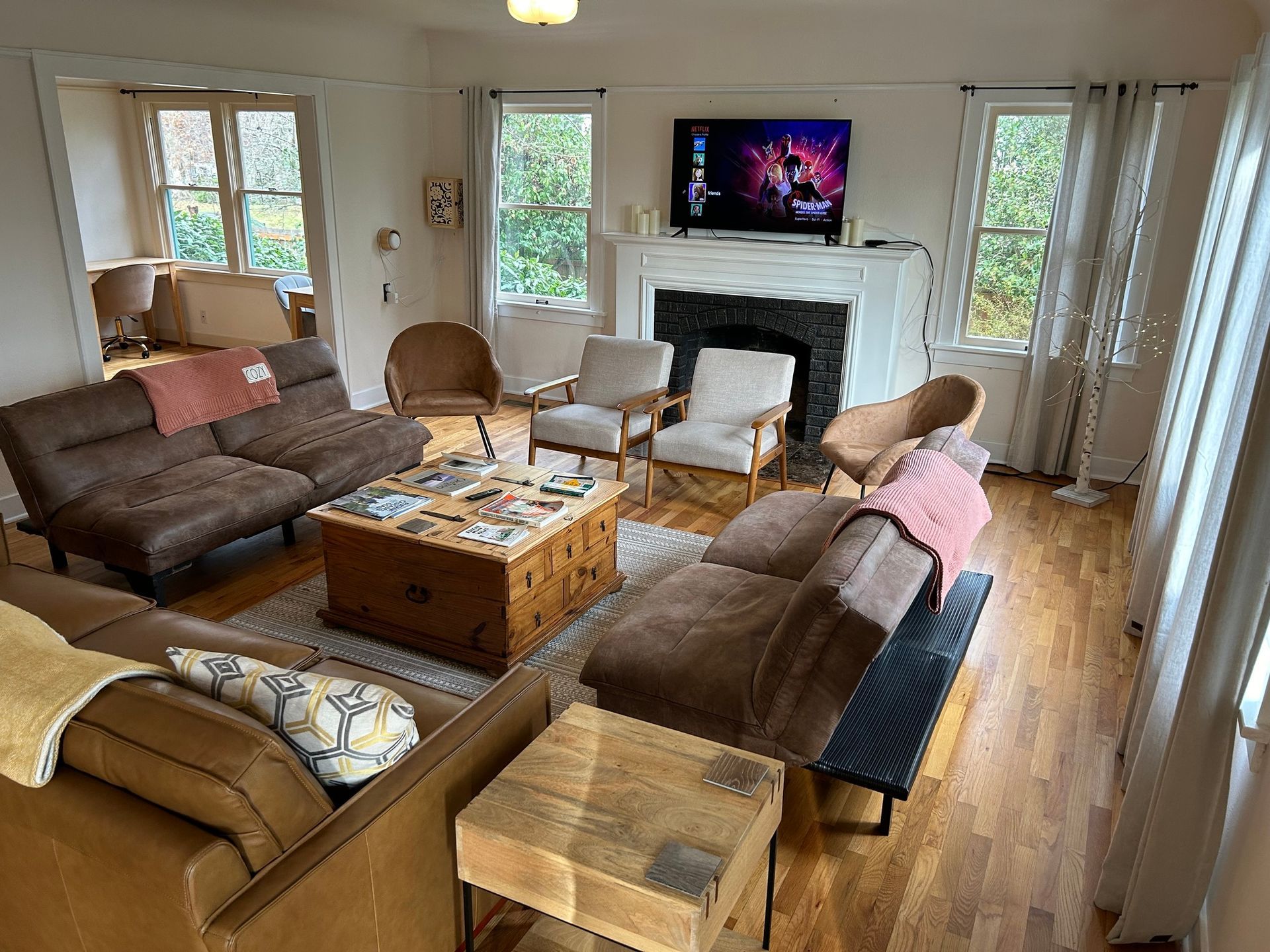 A living room filled with furniture and a fireplace.