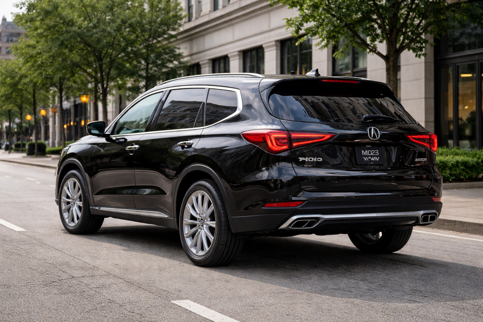 Black Acura SUV parked on a city street. Silver wheels, red taillights, and chrome exhaust.