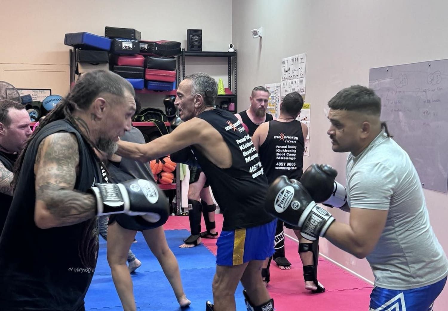 A Group Of Men Are Boxing In A Gym — Maxenergy Fitness In Smithfield, QLD
