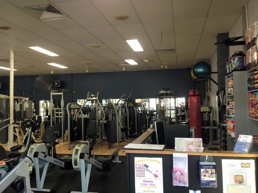 A Gym Filled With Lots Of Exercise Equipment — Maxenergy Fitness In Smithfield, QLD
