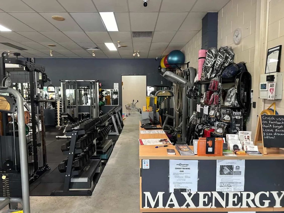 The Inside Of A Gym With A Counter And A Sign That Says Maxenergy— Maxenergy Fitness In Smithfield, QLD