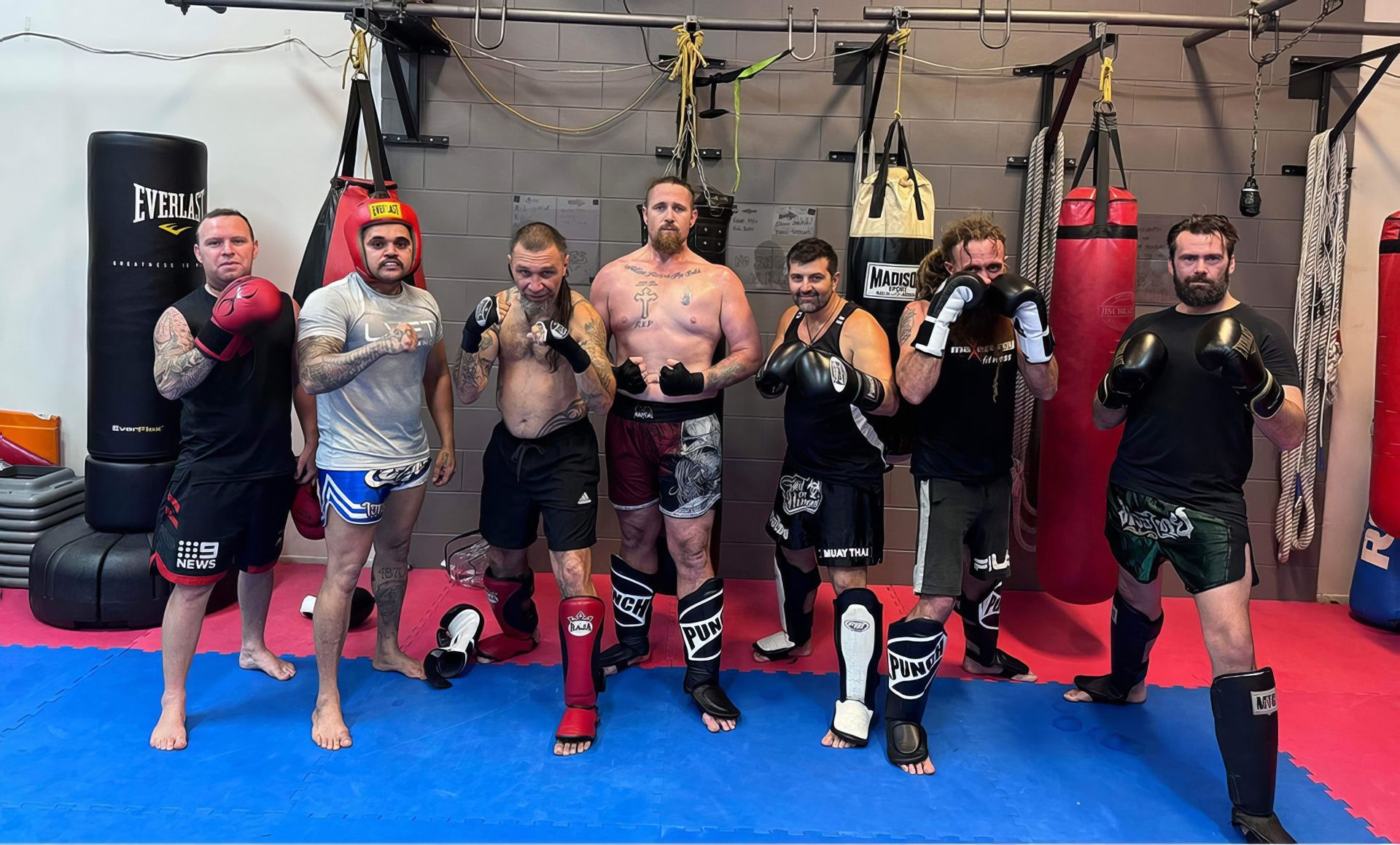 A Group of Men Are Posing for A Picture in A Boxing Gym — Maxenergy Fitness In Smithfield, QLD