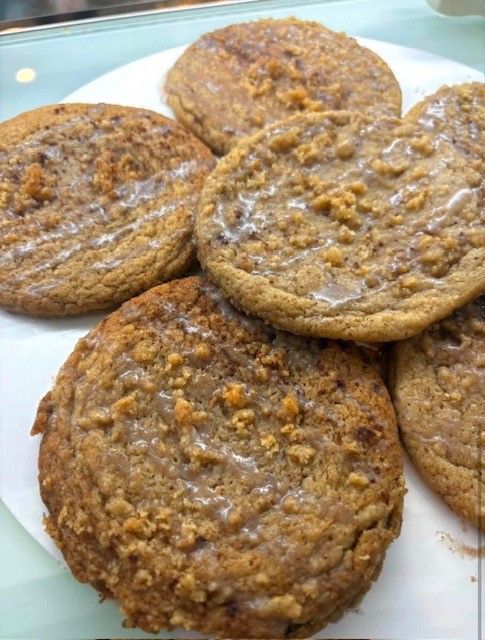 Plate of round brown cookies or oatmeal cakes on a white dish