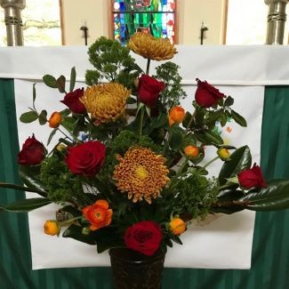 Yellow, orange, and red flower arrangement