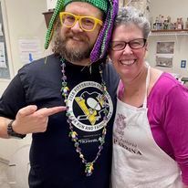 Jonathan and Leslie smiling at Shrove Tuesday pancake supper