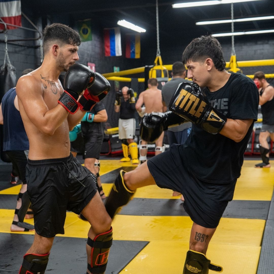 Martial arts athletes training with focus and discipline at Killer B Combat Academy.
