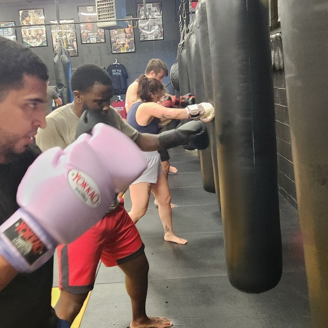 Martial arts students improving coordination and technique at Killer B Combat Academy.