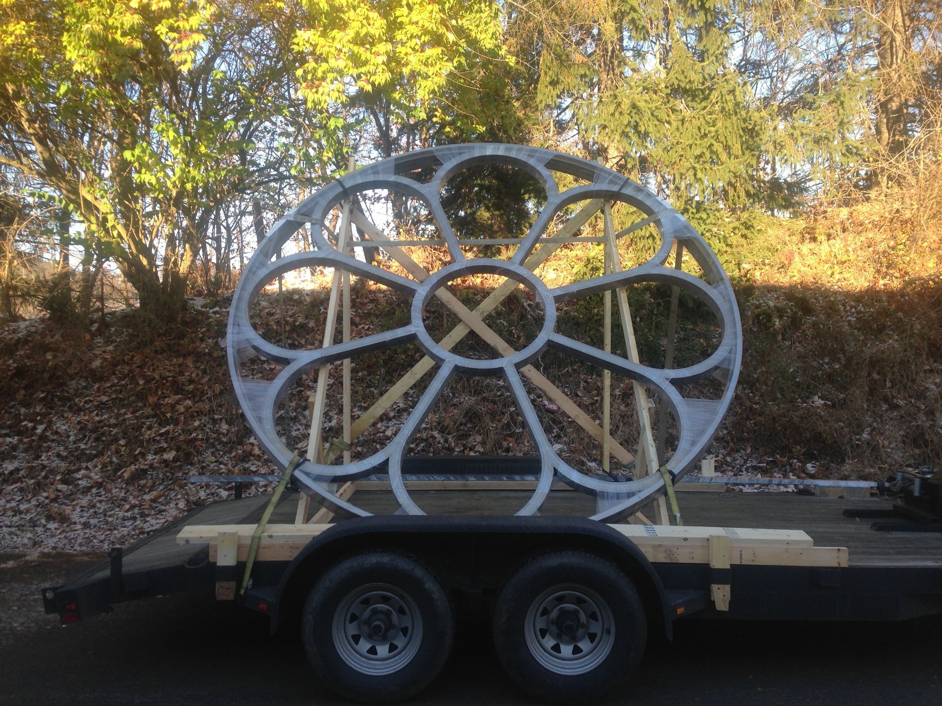 A ferris wheel is sitting on top of a trailer.