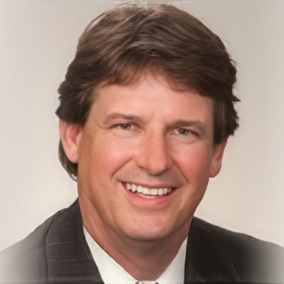A man in a suit and tie smiles for the camera
