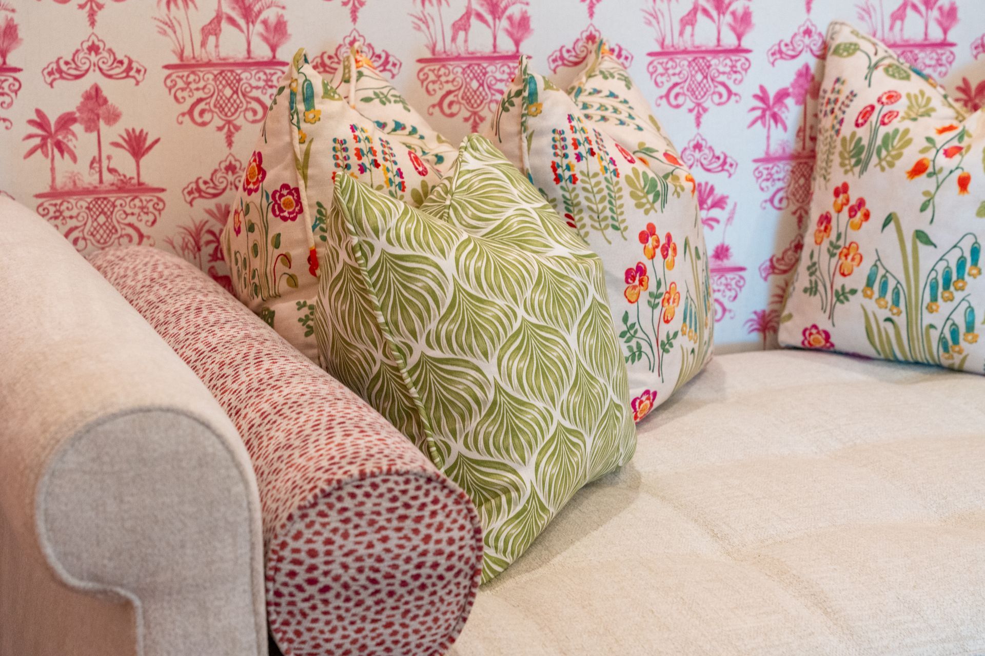 A couch with a bunch of pillows on it