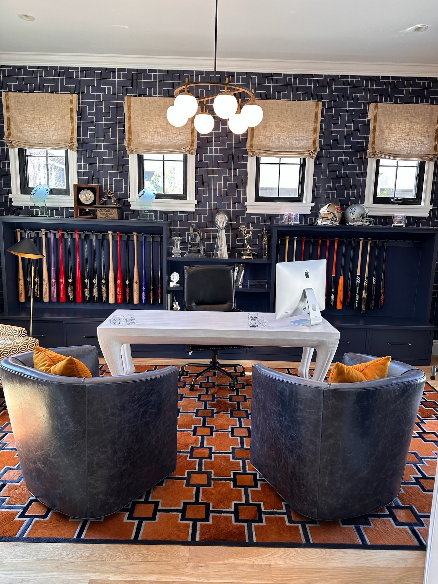 A living room with two chairs and a desk