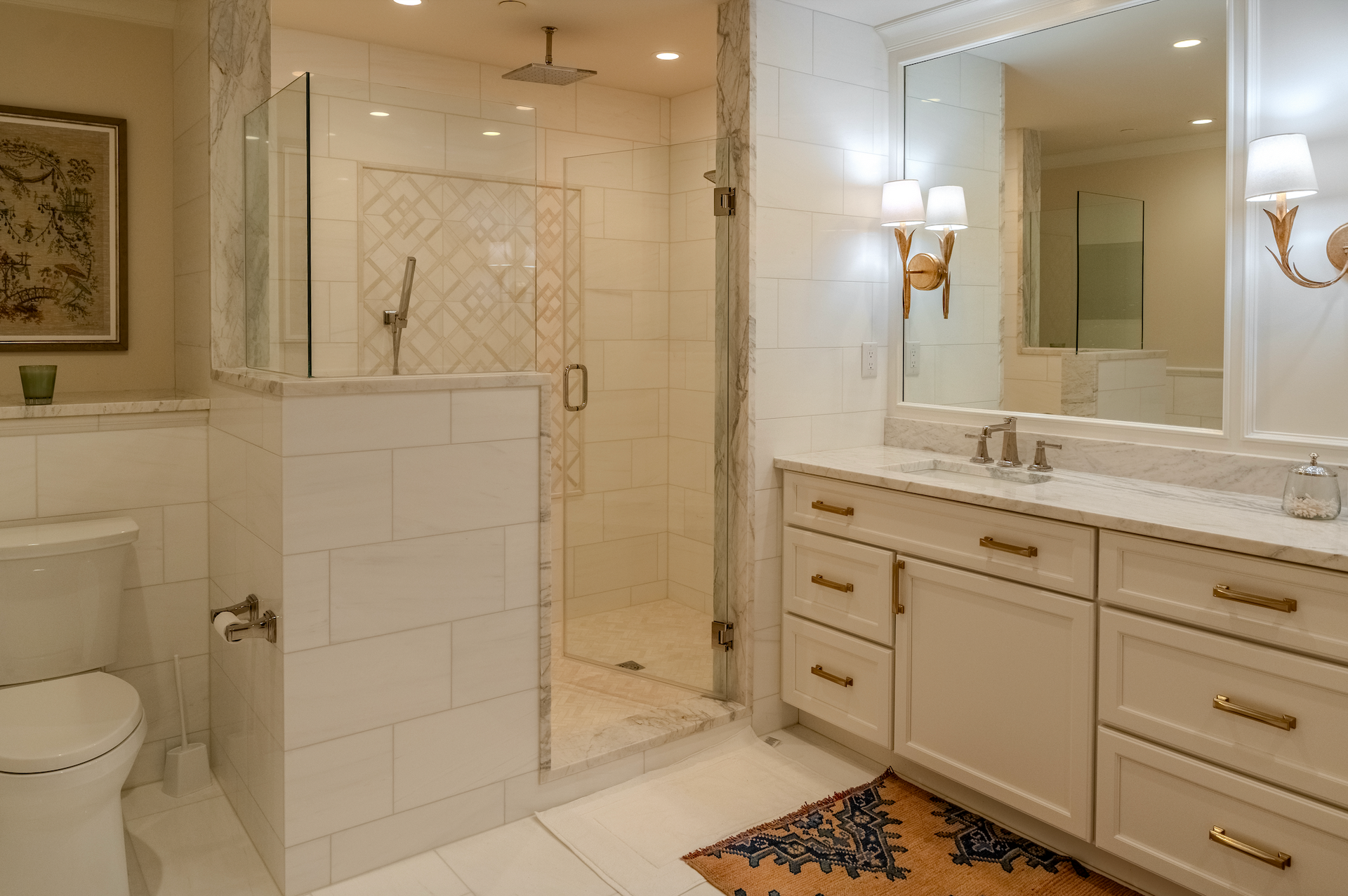A bathroom with a toilet , sink , and shower.