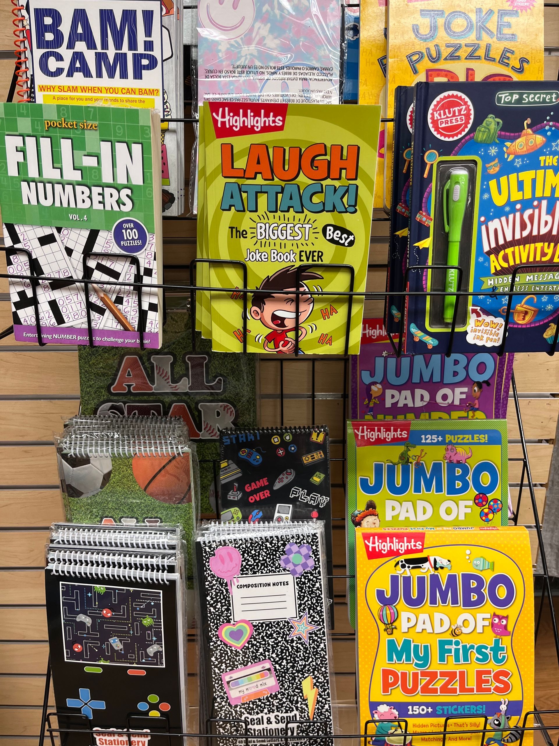 a bunch of books are sitting on a shelf in a store .