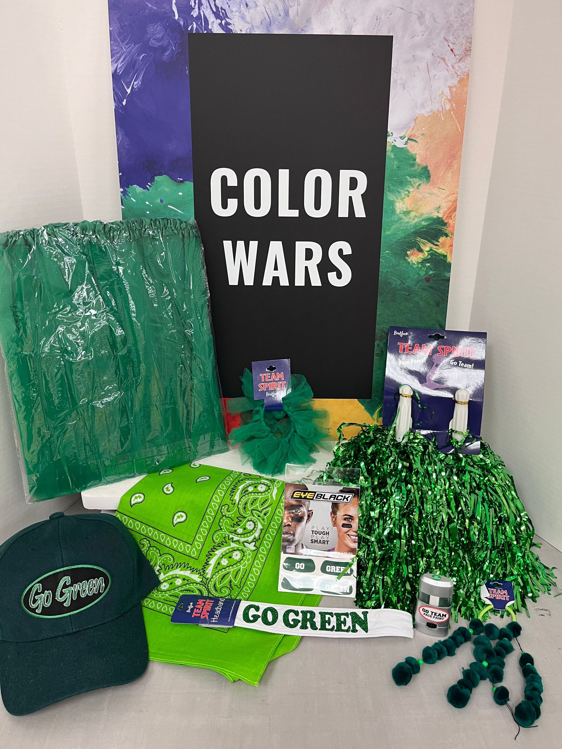 a bunch of green items with a sign that says color wars