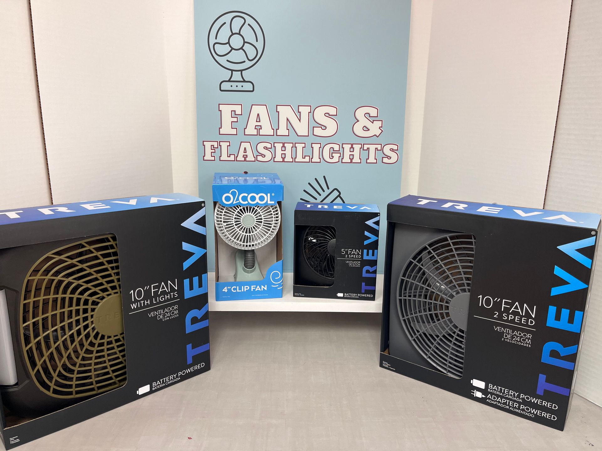 three boxes of treva fans and flashlights are sitting on a table