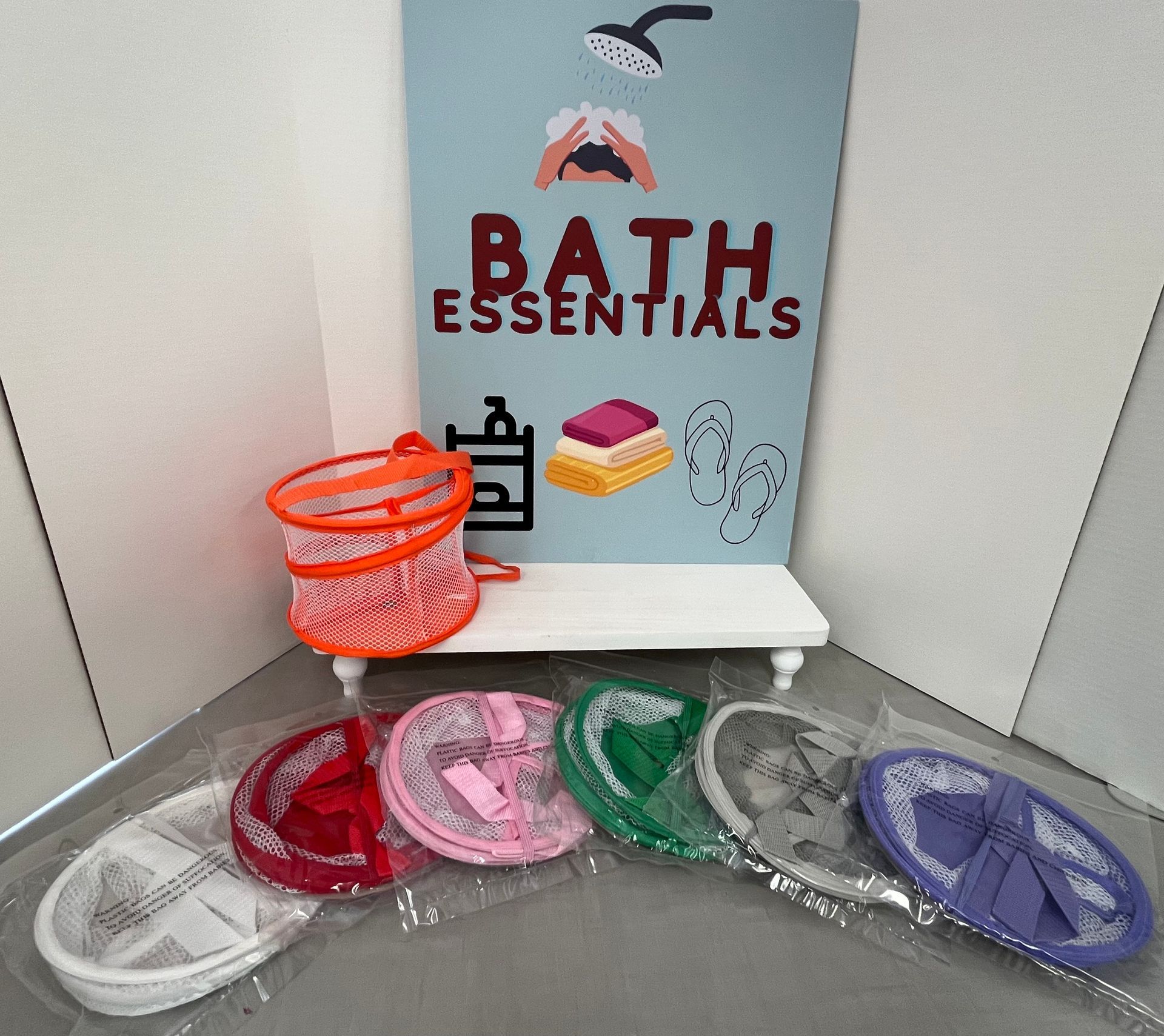 a sign that says bath essentials on it