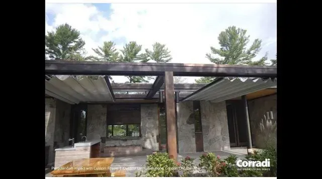 Modern house facade with stone walls, large windows, and a flat roof beneath pine trees