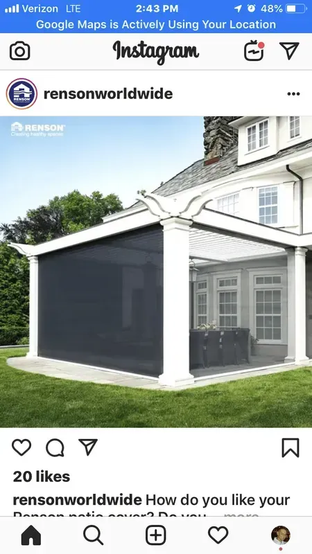 House with dark gray exterior renovation and white trim in an Instagram post screenshot