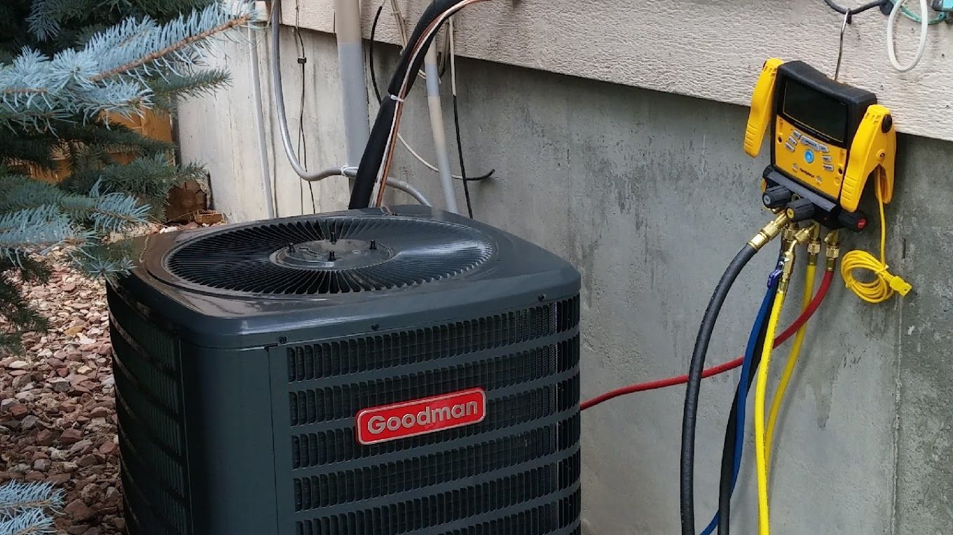 An air conditioner is being installed on the side of a building.