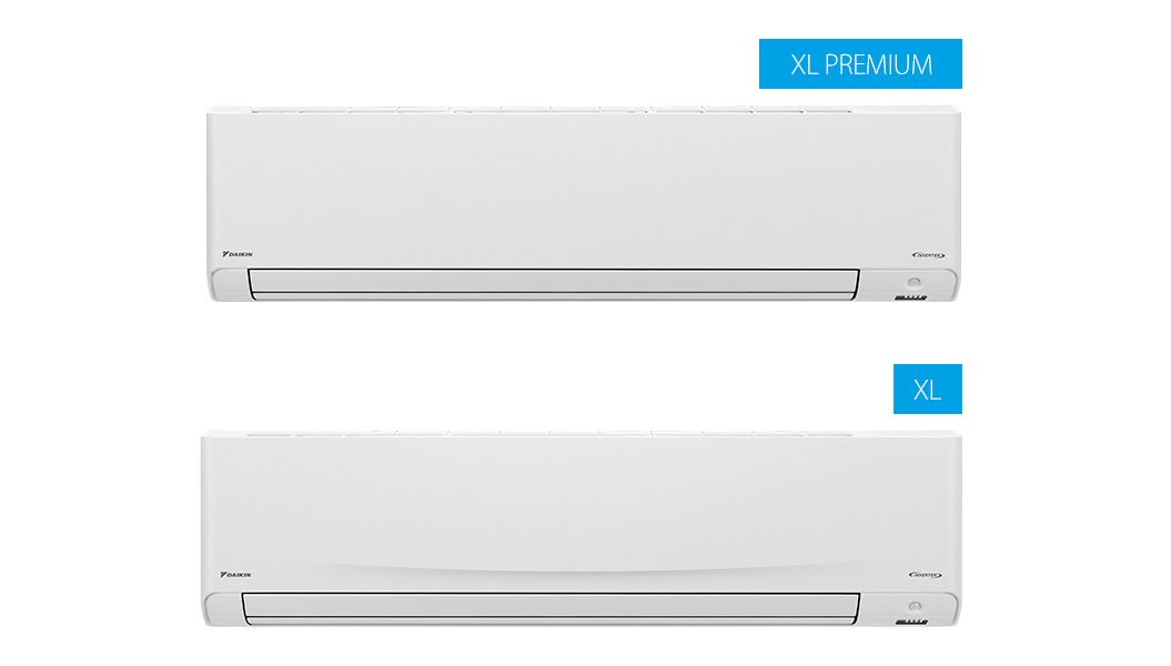 Two White Air Conditioners Are Sitting Next to Each Other on a White Wall — Airac Sales & Service in Gracemere, QLD