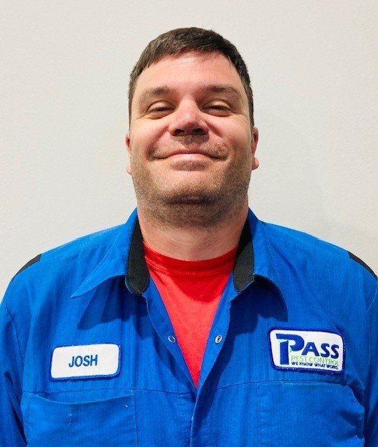 Man named Josh in a blue work uniform with the name tag