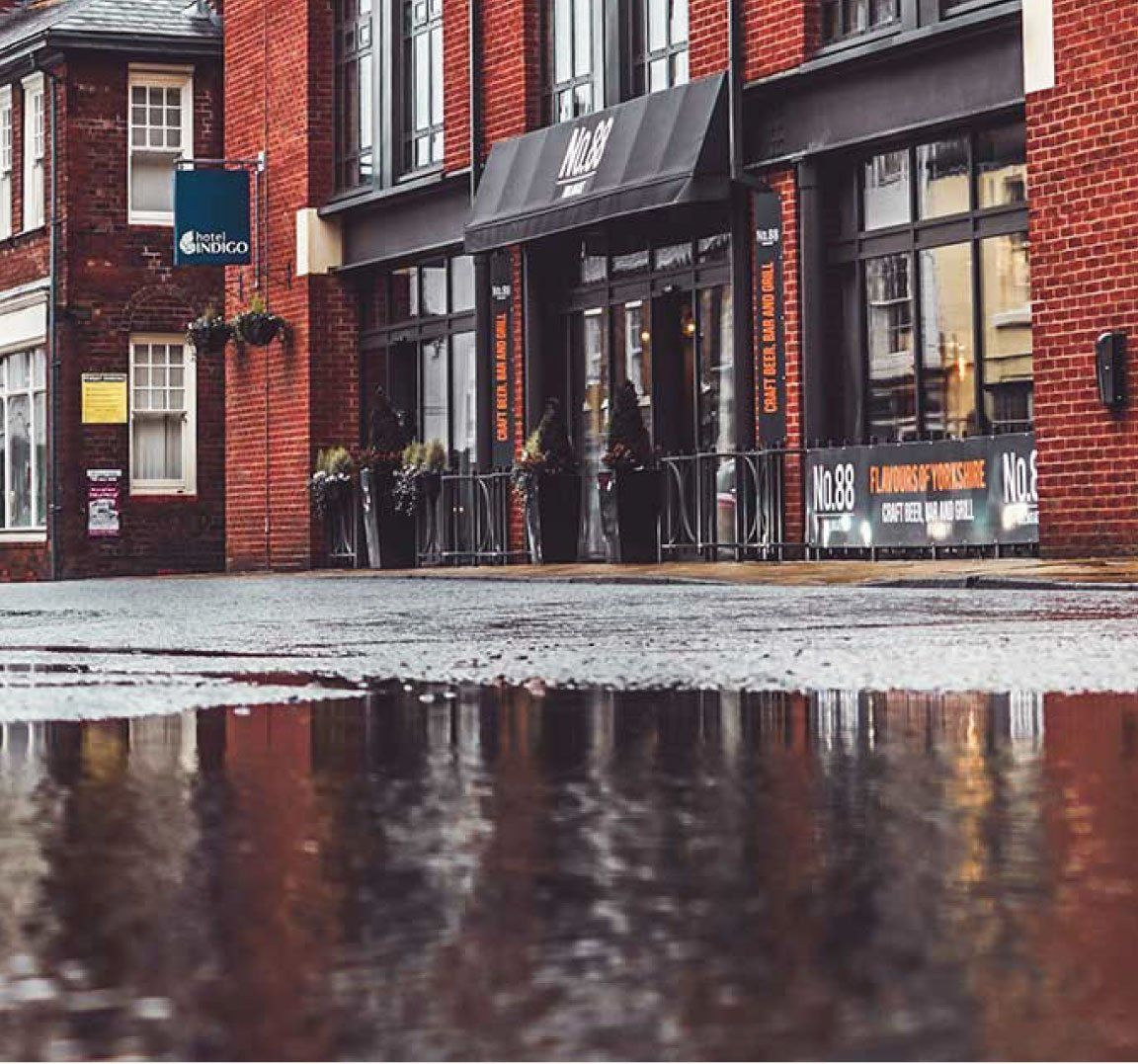 Flood water on the street of a store front