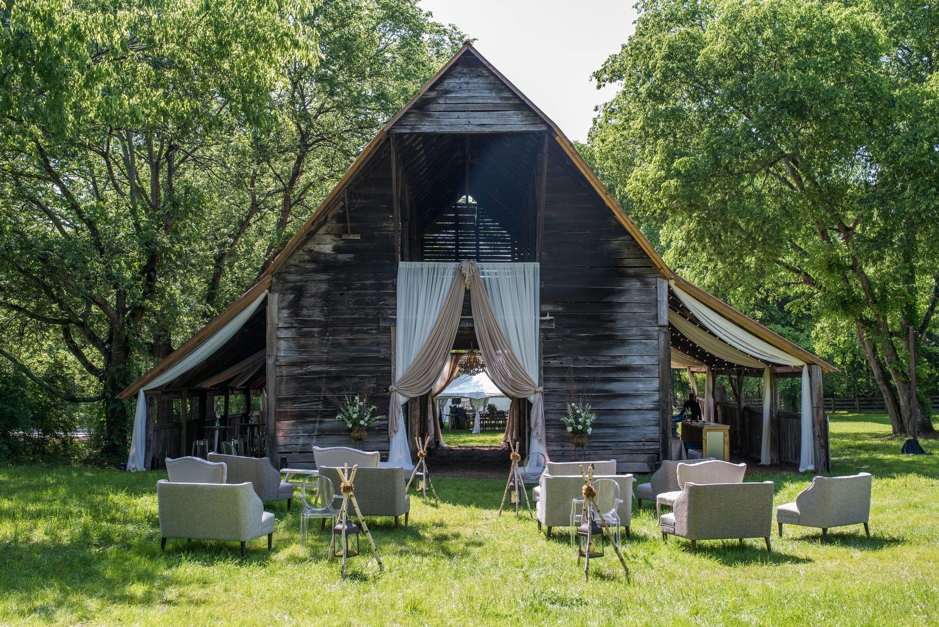 Beech Grove Historic Venue barn is decorated for a wedding with chairs and tables by Wedding Events Planner