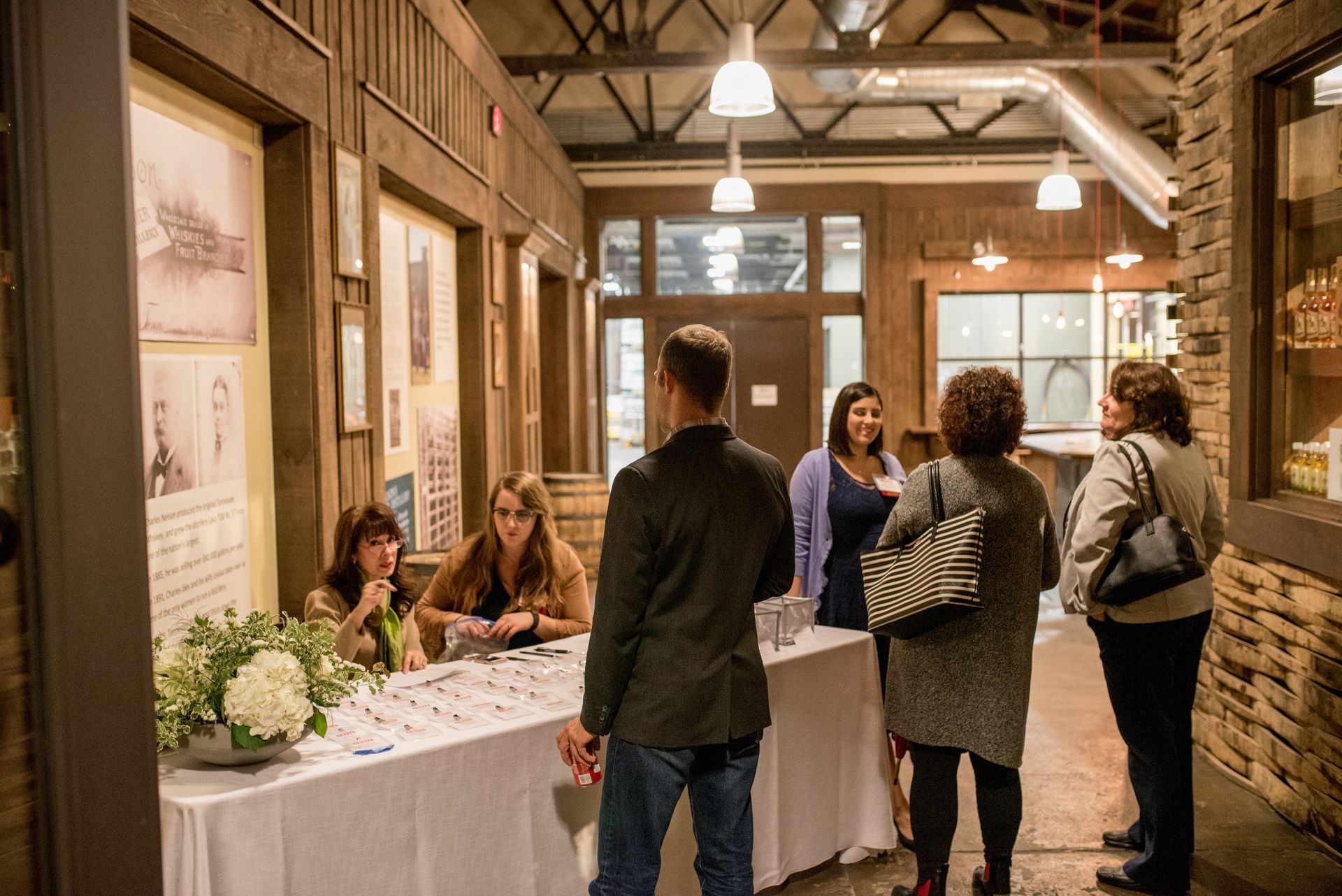 TWESA Vendor Speed Dating Event, group of people are standing around a table in a hallway by Event Planner Nashville
