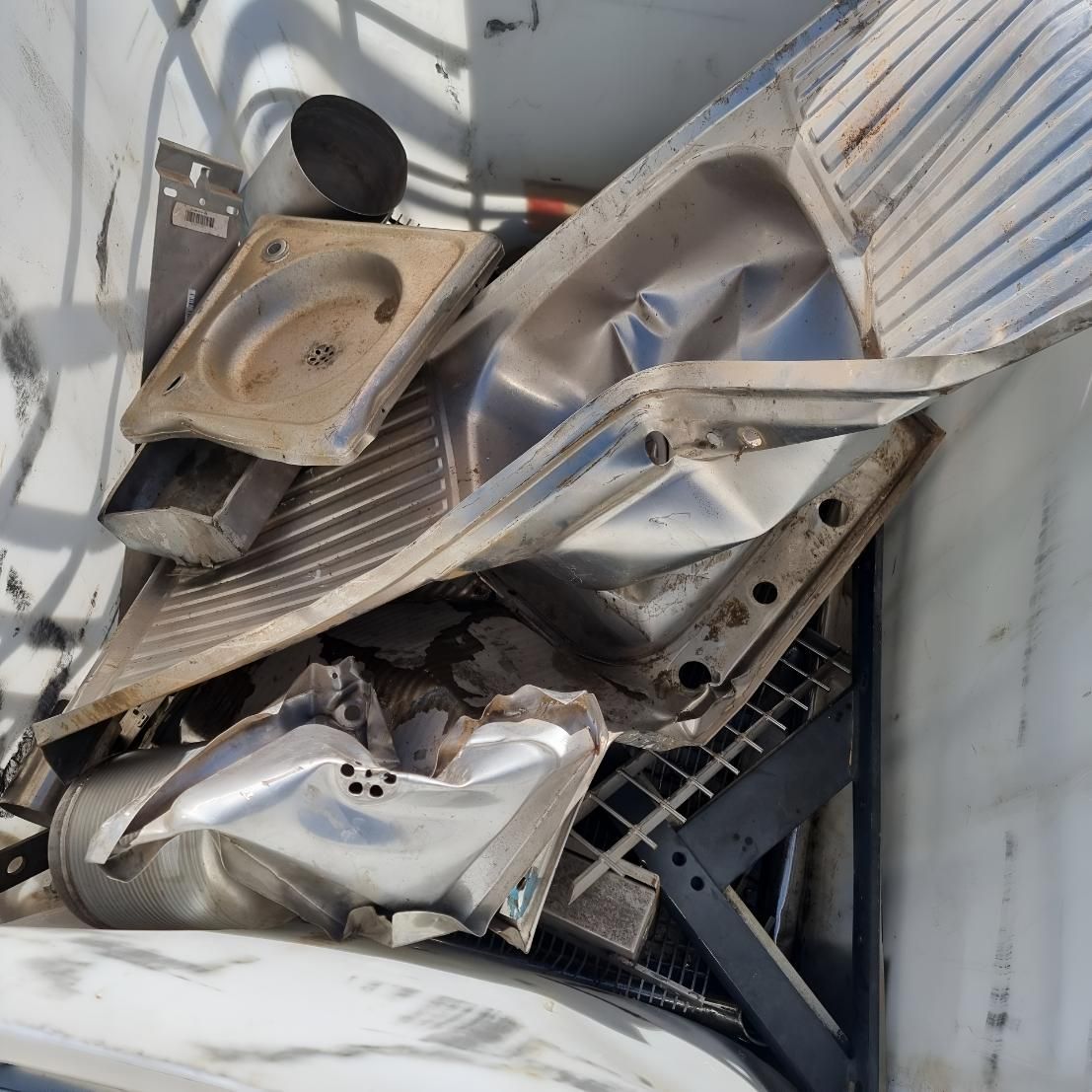 Pile of Junk is Sitting on Top of a White Surface — Beehive Property Maintenance in Capella, QLD
