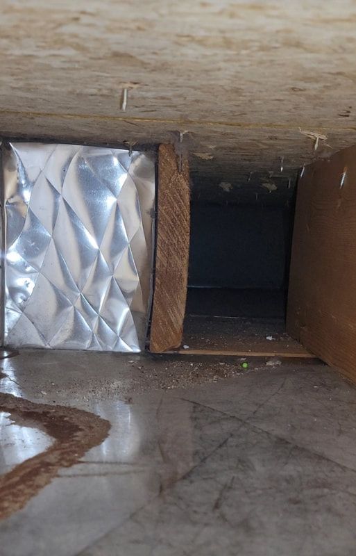There is a hole in the ceiling that looks like a hole in the floor.