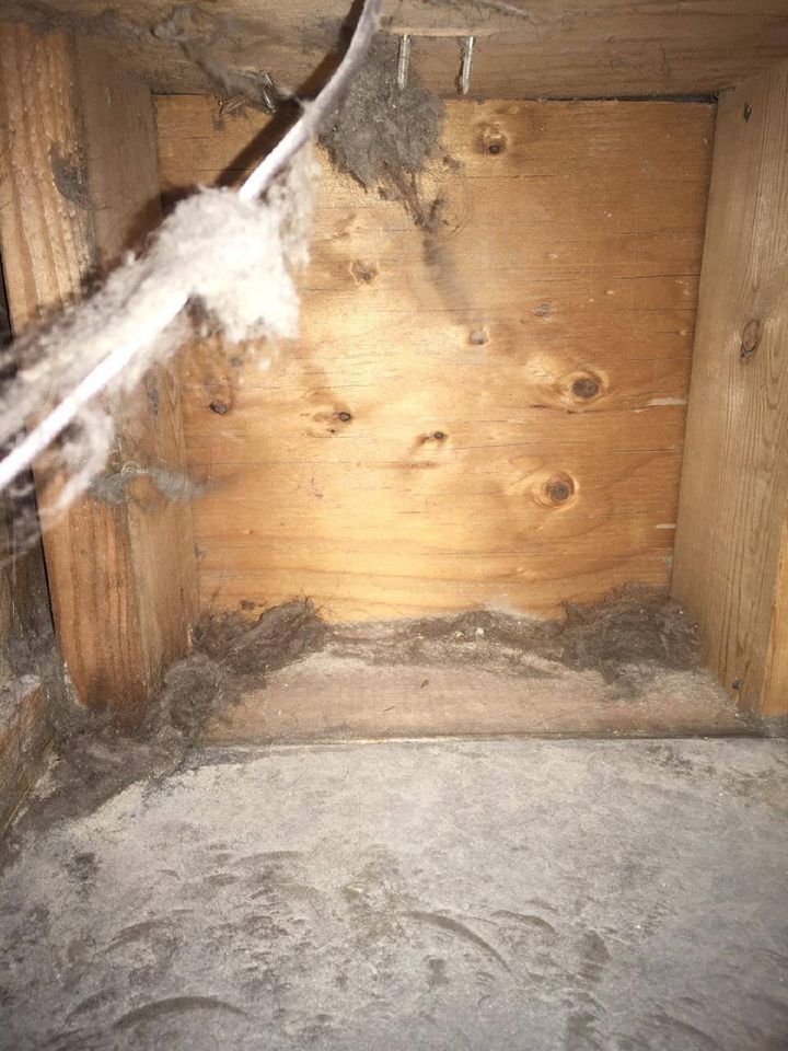 A wooden box with a lot of dust on it.
