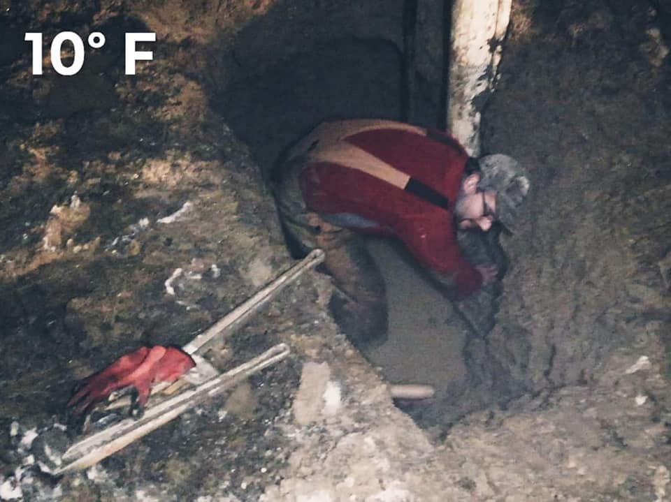 Man Fixing Underground Pipe Leak — Union City, IN — Wiley Water Systems