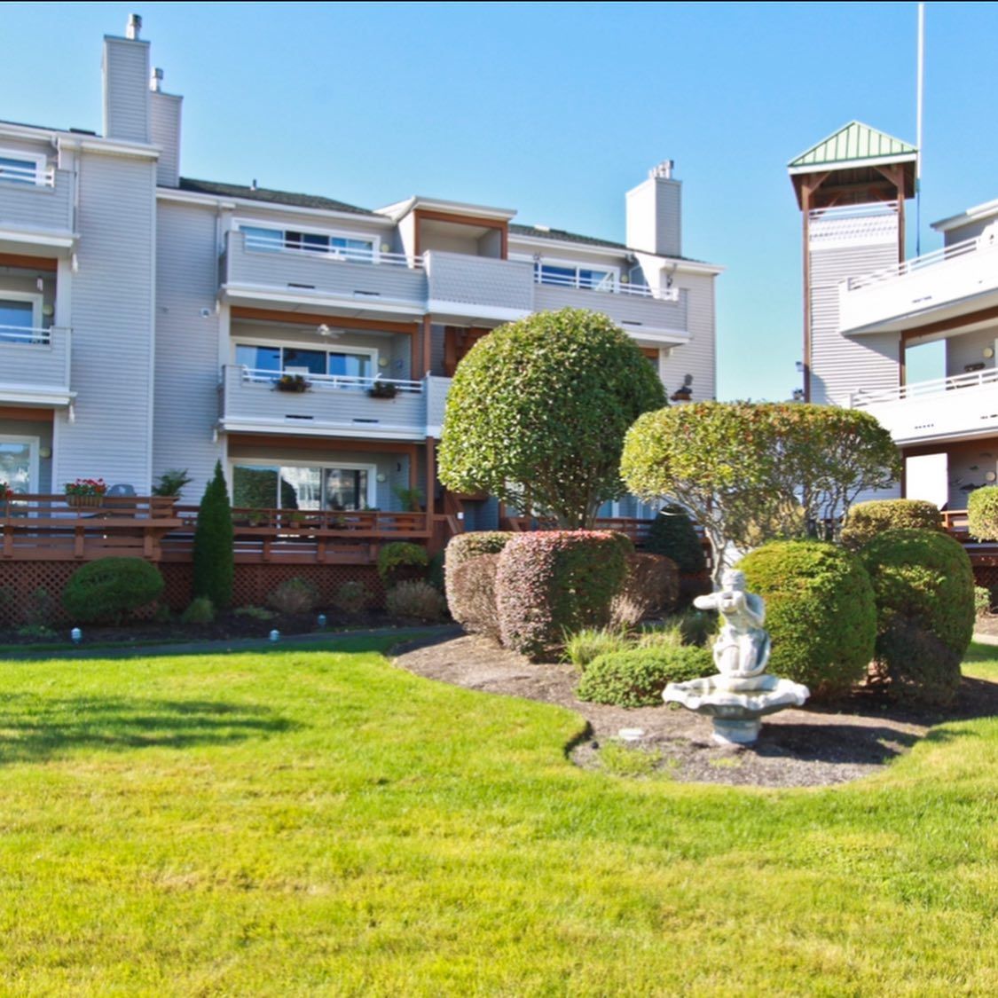 A large building with a fountain in front of it