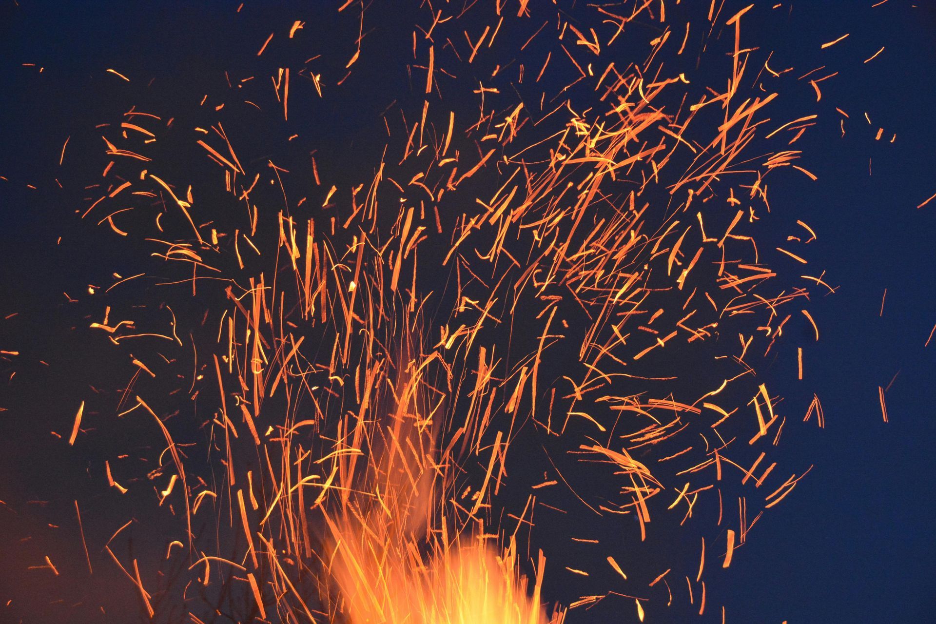 A fire with lots of sparks coming out of it