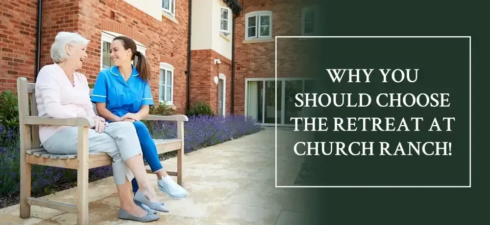 Two women are sitting on a bench talking to each other.