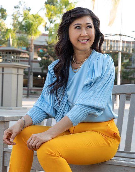 Rosa Tran Sitting on a bench