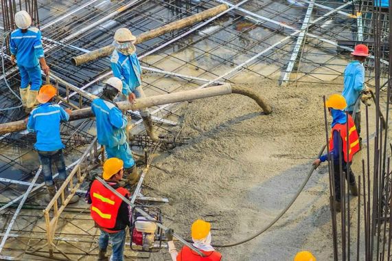 pouring concrete to a second floor slab building