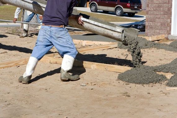 pouring concrete at new concrete driveway