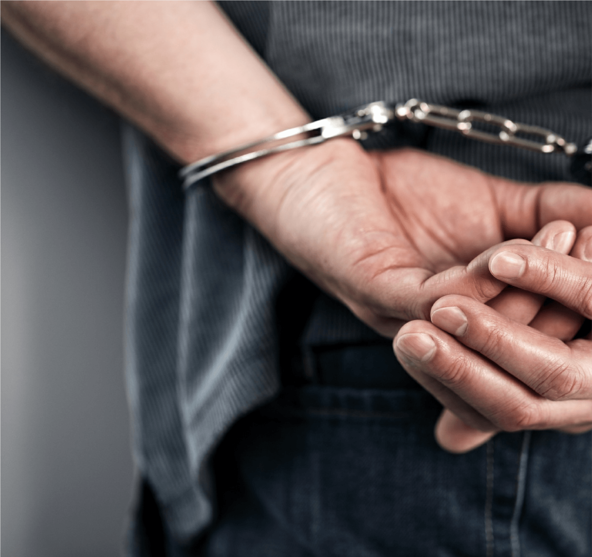 Man in Handcuffs — Fort Walton, FL — Matt McKeehan Bail Bonds Man in Handcuffs — Fort Walton, FL — Matt McKeehan Bail Bonds