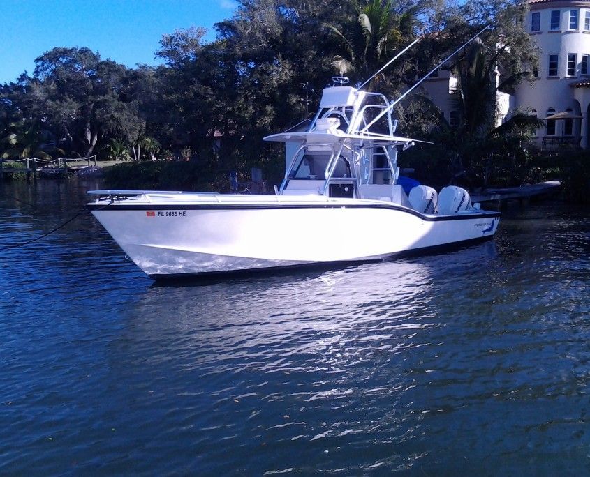 a white boat with a license plate that says florida