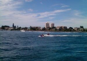 A group of people are riding a jet ski in the ocean.