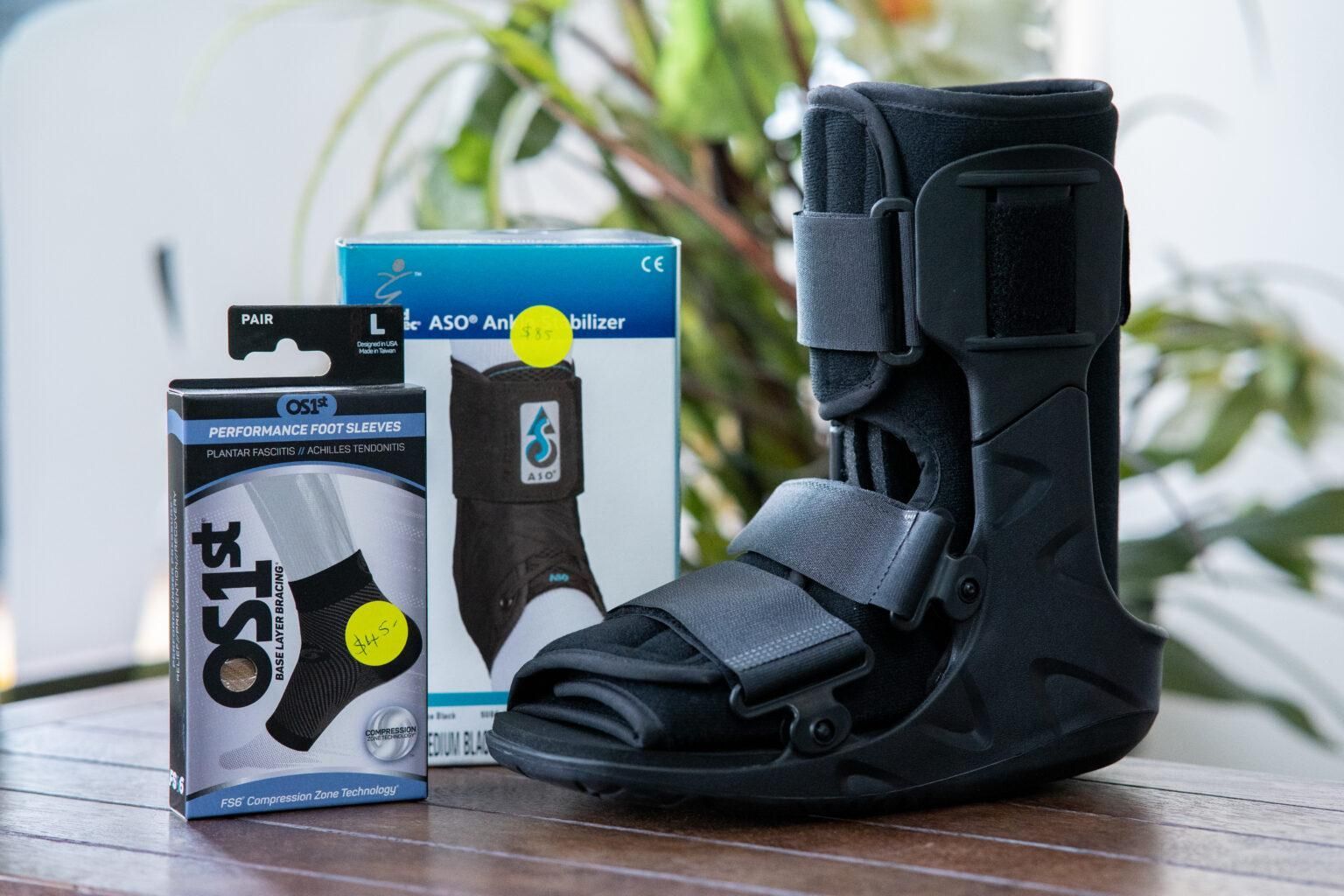 A Black Boot Is Sitting On A Wooden Table — Port Macquarie Physio & Pilates In Port Macquarie, NSW