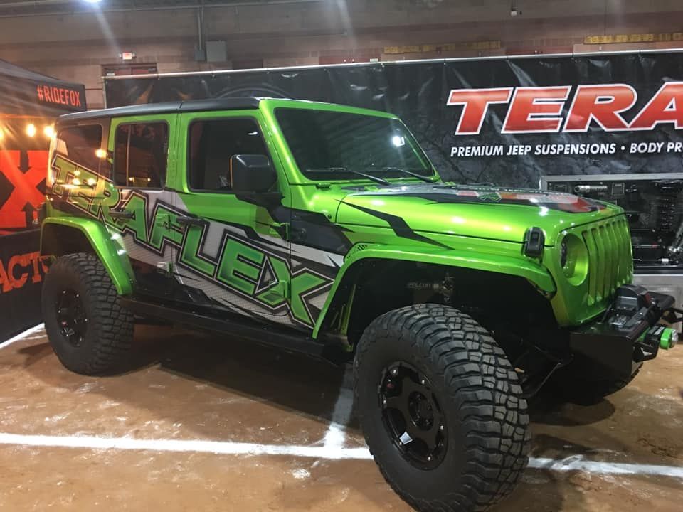 A lime green, modified Jeep Wrangler with 