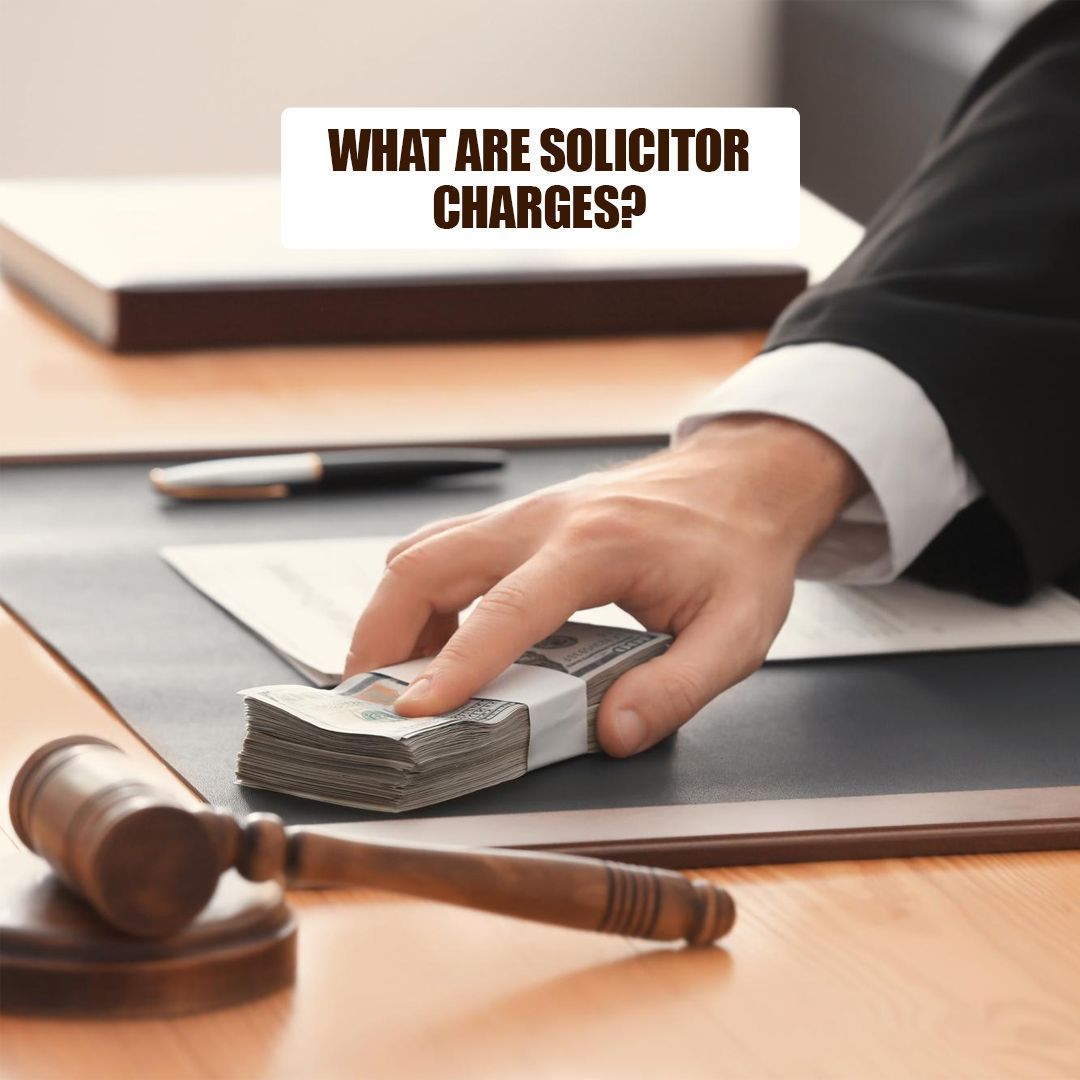 A hand placing a wad of money on a desk next to a gavel and papers, with text overlay: