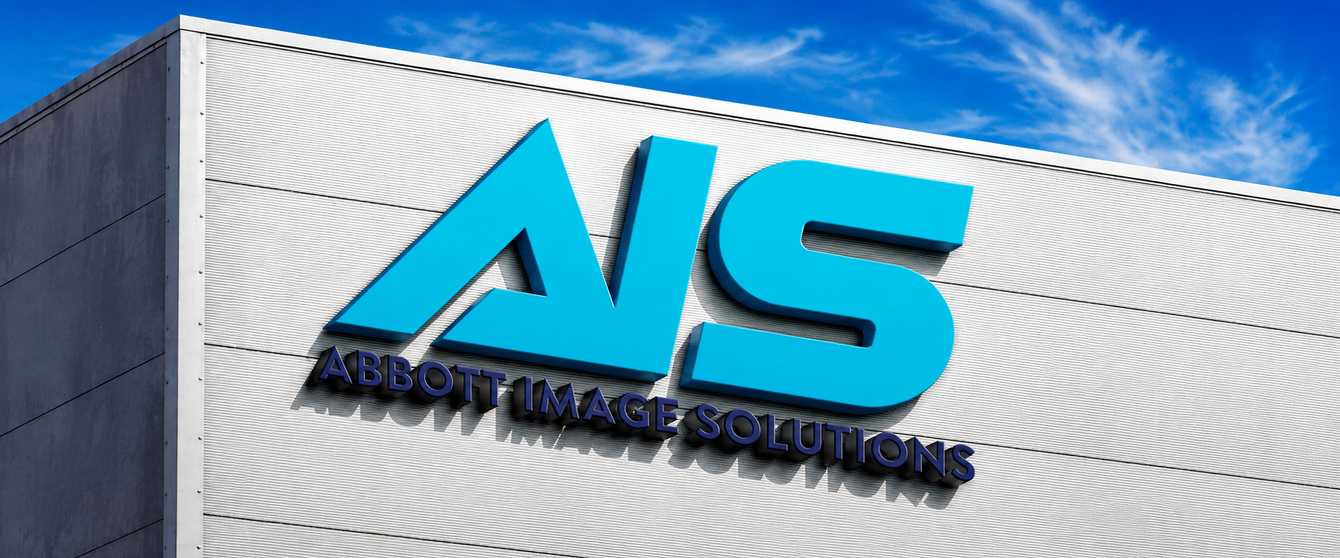 AIS logo on a building facade under a blue sky