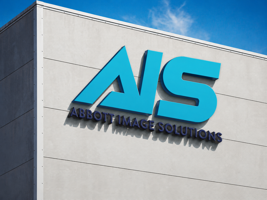 AHS logo on a building wall with Abbott image solutions text underneath